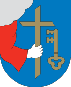 Hand holding Christian cross in the coat of arms of Pärnu
