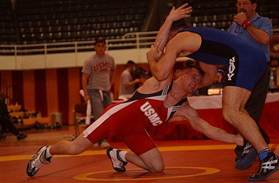 A takedown attempt during a freestyle match.