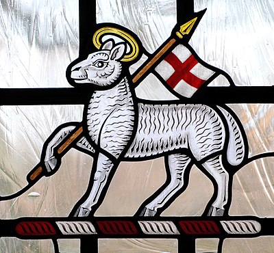 Paschal Lamb with the banner symbolising Christ's resurrection. Stained Glass, Anglican cathedral at Guildford, Surrey, England.