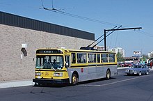 One of the E800 trolley buses using the overhead wires that opened at Eastgate Square mall in 1986 Hamilton Flyer E800A trolleybus leaving Eastgate Square in May 1987.jpg