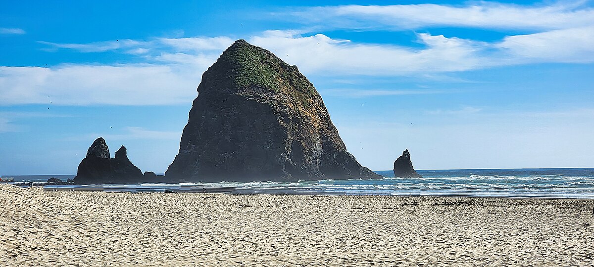 Picking Stone, Manzanita, Tillamook County, Oregon, USA - Stock