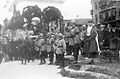 King Ferdinand and Queen Marie saluting the troops.