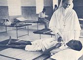 Salesian sister caring for sick and poor in former Madras Presidency, India. Catholic women have been heavily involved as educationalists and care givers. Hunger and sickness Madras.jpg