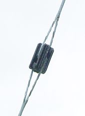 Cylindrical strain insulator of type used on utility pole and antenna mast guys. Johnny ball strain insulator.JPG