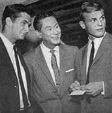 Perkins (far left) with Tab Hunter (far right), whom he dated Juke Box Jury May 1957.jpg