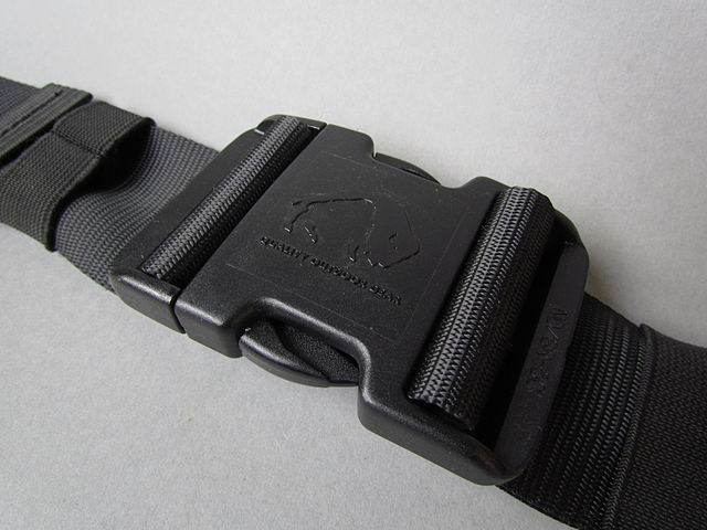 A buckled side release buckle attached to webbing