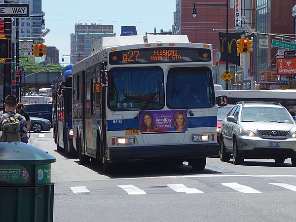 A Flushing-bound Q27 turning onto 39th Avenue from Main Street