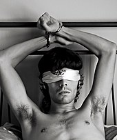 Man handcuffed to a bedrail, with a blindfold on Man Cuffed to Bedrail.jpg