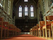 The Gothic Revival 19th century chapel of Mansfield College, Oxford, an English Calvinist foundation, with statues and stained glass figures of divines of the Reformed tradition Mansfield Chapel.jpg