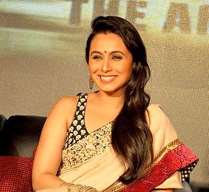 Rani Mukerji is smiling away from the camera