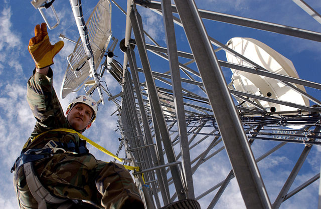 Technician from 142nd Fighter Wing working on a communications tower