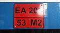 Plat pada KRL seri EA203 yang menyatakan nomor jenis kelas sarana KRL (bukan jenis kelas layanan), berat maksimum, dan kodefikasi kereta