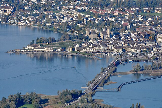 Rapperswil as seen from Etzel mountain: Capuchin monastery to the left, Rapperswil castle and St. John's church in the background, Lake Zürich harbour