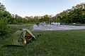 * Nomination: Green Rock Empire tent built in woods near Mutěnice, Hodonín District, South Moravian Region, Czechia --T.Bednarz 09:43, 27 May 2020 (UTC) * Review  Comment The tent is quite soft and noisy, and everything else is completely out of focus. Also it seems distorted and probably needs some perspective correction (e.g. look at the masts in the background). Also quite dark - can you please try making it a little brighter? --Domob 14:45, 4 June 2020 (UTC)