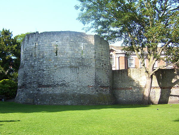 Roman wall and the west corner tower of Eboracum. The top half is medieval.