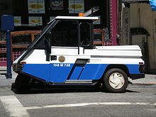 A San Francisco Police Department parking enforcement motorized tricycle SFPD parking enforcement vehicle side.JPG