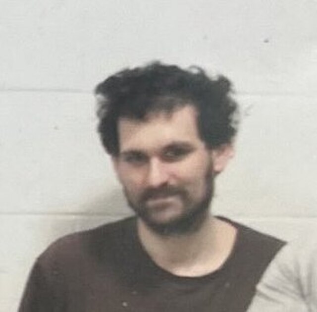 Bankman-Fried at the Metropolitan Detention Center, Brooklyn in 2023 (cropped image). See also complete image showing jail context.