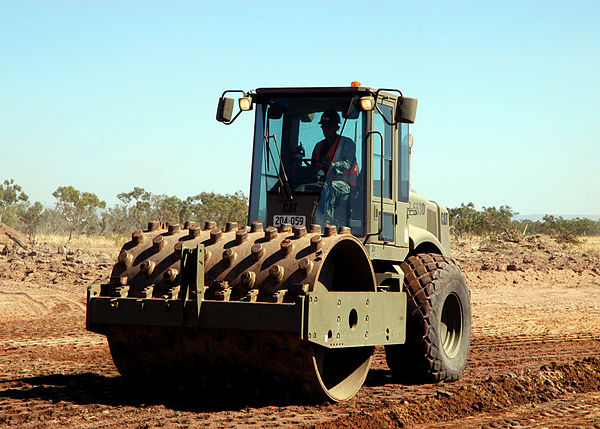 A compactor/roller operated by U.S. Navy Seabees