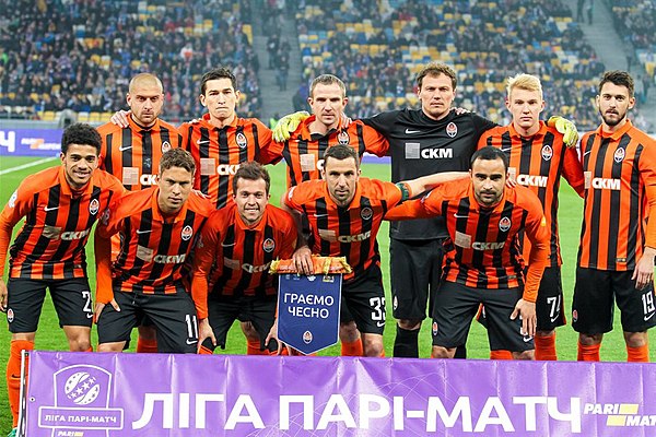 The 2017 Liha Pari-Match champions FC Shakhtar Donetsk with a pennant (Hrayemo Chesno, We Play Fair)