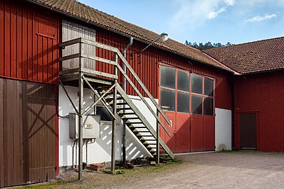 Stairs on a barn on Röe Gård with snow starting to fall