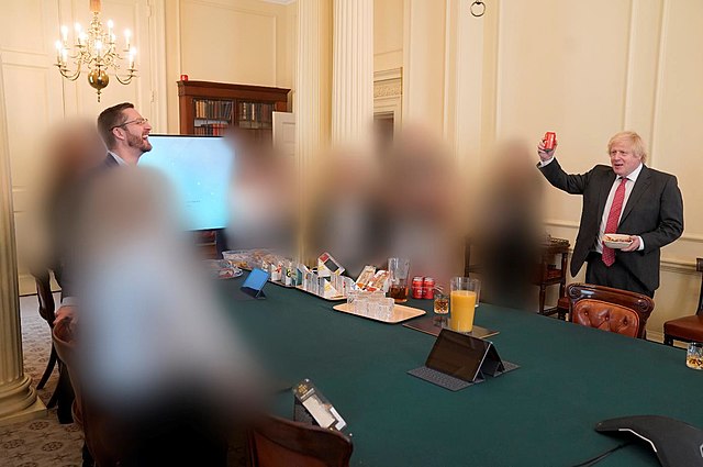 Colour photograph of Boris Johnson, Simon Case and unidentified others with their faces blurred at a surprise birthday party for Johnson, at a time when such gatherings were against the law.