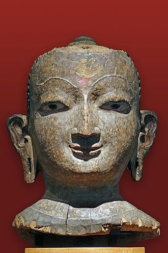 An image of Jina. 18th-century wood with traces of polychromy in National Museum of Asian Art - Guimet Room Nepal Tete de Jina (Musee national des arts asiatiques - Guimet) (14480539475).jpg