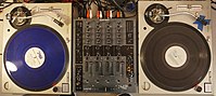 Two SL-1200M3Ds set up for DJ battle, or scratching, mixing. An Allen & Heath 4-Channel with Effects Mixer sits between the two turntables, allowing shorter travel during battles, or competitions. Technics 1200 and Xone 42 1 2016-06-17.jpg