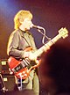 Colour photograph of Moe Tucker performing live in 1992