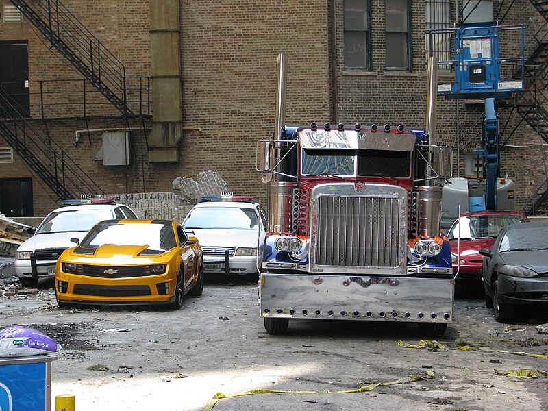 File:Transformers 3 set in Chicago - Bumblebee and Optimus Prime vehicles.jpg