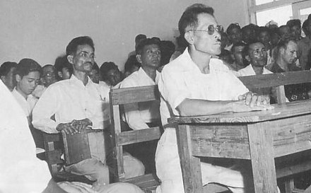 Kamejiro Senaga (at left, holding book)
