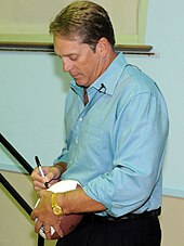 Jack Del Rio US Navy 101116-N-5516S-001 Jack Del Rio, Jacksonville Jaguars head coach, autographs a football for a participant in the Jack Del Rio Foundation's (cropped).jpg
