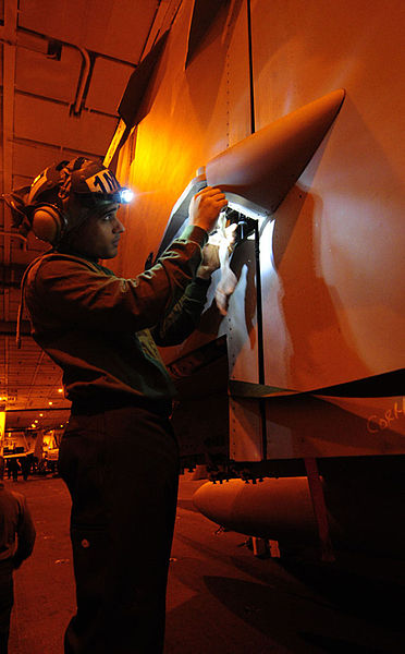 File:US Navy 101201-N-7422B-037 PACIFIC OCEAN (Dec. 1, 2010) Aviation Structural Mechanic 3rd Class Quinones Ortiz cleans corrosion from the ball beari.jpg
