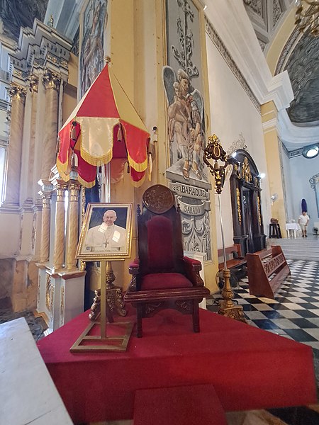 Conopaeum (left), tintinnabulum (right), and a papal chair (middle), one of the privileges granted to a basilica