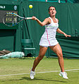 Verónica Cepede Royg competing in the first round of the 2015 Wimbledon Qualifying Tournament at the Bank of England Sports Grounds in Roehampton, England. The winners of three rounds of competition qualify for the main draw of Wimbledon the following week.