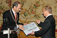 Job Cohen and President of Russia Vladimir Putin during a presentation in Amsterdam on 1 November 2005. Vladimir Putin in the Netherlands 1 November 2005-13.jpg