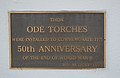 English: Plaque commemorating the installation of the ode torches on the war memorial in Werris Creek, New South Wales