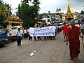 Image 38Protesters in Yangon with a banner that reads non-violence: national movement in Burmese, in the background is Shwedagon Pagoda. (from History of Myanmar)