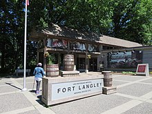 Entrance to the national historic site. The site's visitor centre is visible in the background. 2018 05 27d Fort Langley 1 (28987867538).jpg