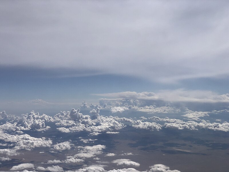 File:2021-10-05 14 01 09 Cumulus clouds and cirrus anvil over San Bernardino County, California viewed from an airplane heading towards Los Angeles International Airport.jpg