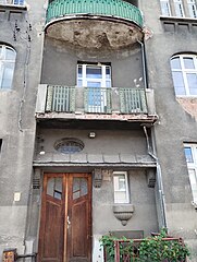 Detail of the entrance and balcony