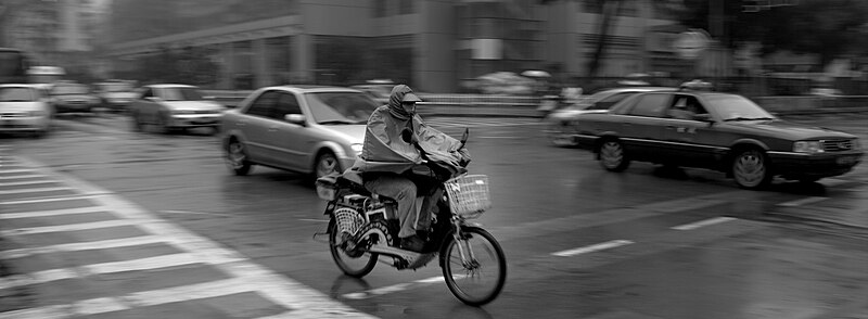 File:A motorbike in the cars.jpg