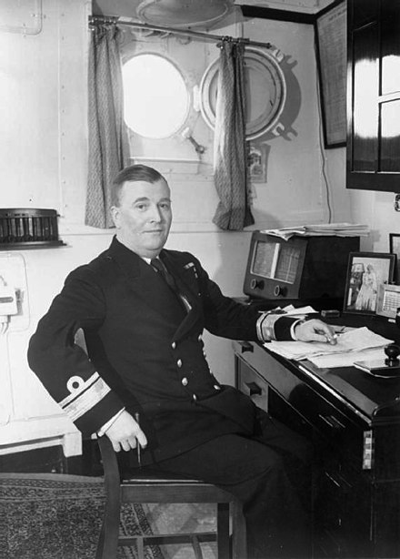Admiral Burnett in his cabin aboard HMS Belfast.