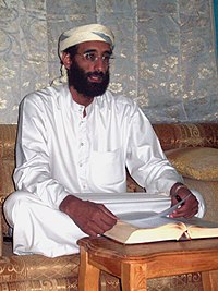 Anwar al-Awlaki sitting on couch, lightened.jpg