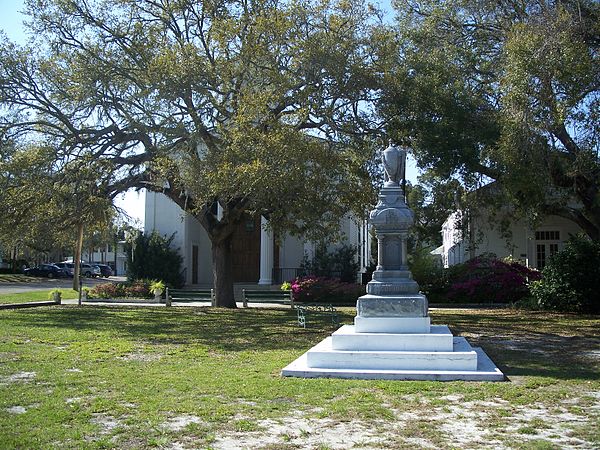 John Gorrie Monument, located in Gorrie Square, with Trinity Episcopal Church in the background