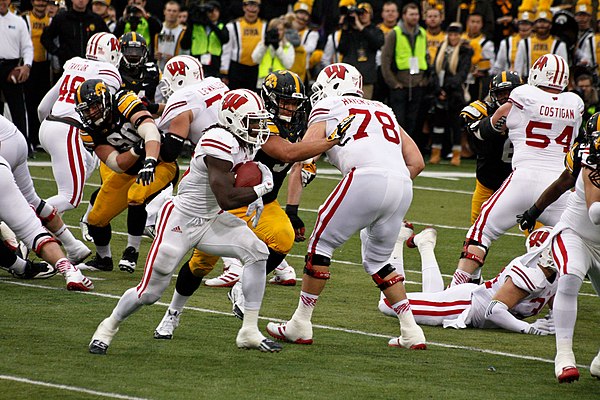 Gordon running against the Iowa Hawkeyes defense in 2014 at Kinnick Stadium