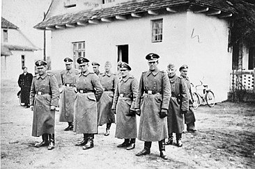 SS personnel at the Belzec extermination camp, 1942. The SS was the leading Nazi organisation involved in the extermination of 5.5 to 6 million Jews Belzec - SS staff (1942).jpg
