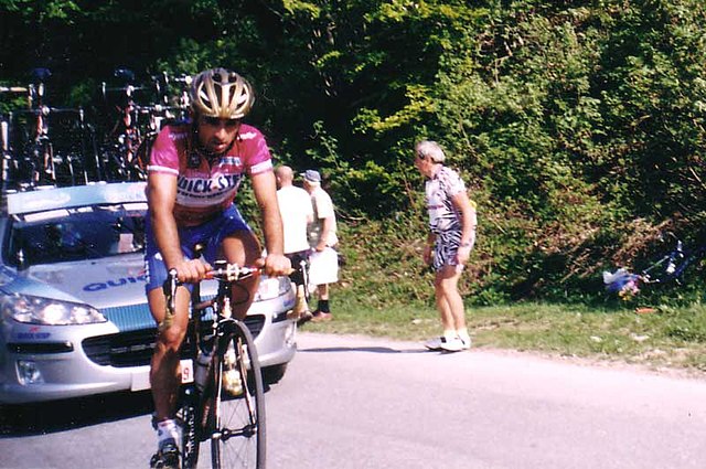 Paolo Bettini wearing the purple jersey as leader of points classification while climbing the Colle di Tenda during stage 17.