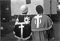 Bishop Solomon and Amanda Mpehla show backs of their church uniforms (7996029666).jpg