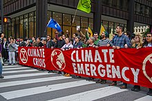 An example of the terms climate crisis and climate emergency being used together during a protest march Blocking Downtown Streets and Intersections Extinction Rebellion Action Chicago Illinois 10-7-19 3415 (48869205986).jpg