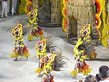 The Brazilian Carnival parade in Rio de Janeiro is given meanings through shared understanding of culturally defined rules. Brazilian Carnival.jpg